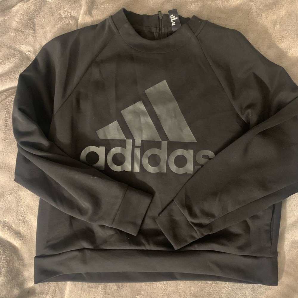 Adidas pull over. With zipper in the back. Medium